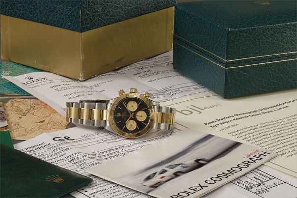 An extremely rare and possibly unique 18k gold and stainless steel chronograph wristwatch with presentation box and associated papers and images.